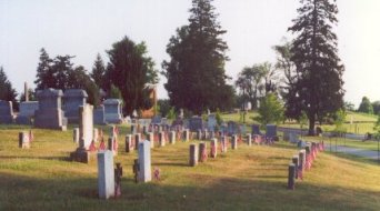 Two Confederate graves are in the foreground, behind them are the Unoin soldiers graves.  The National Cemetery holds the majority of Union men buried in the area.