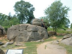 The rocks here are REALLY BIG!  Yes that's a man climbing the top rock near the center.